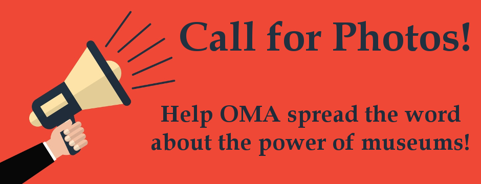 Orange background with cartoon arm holding megaphone with text, "Call for Photos - Help OMA spread t